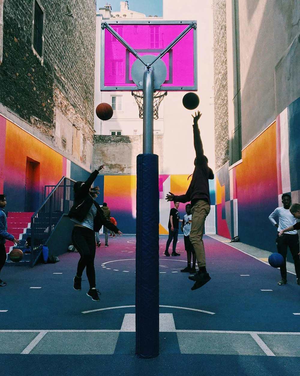 a group of people playing a game of basketball