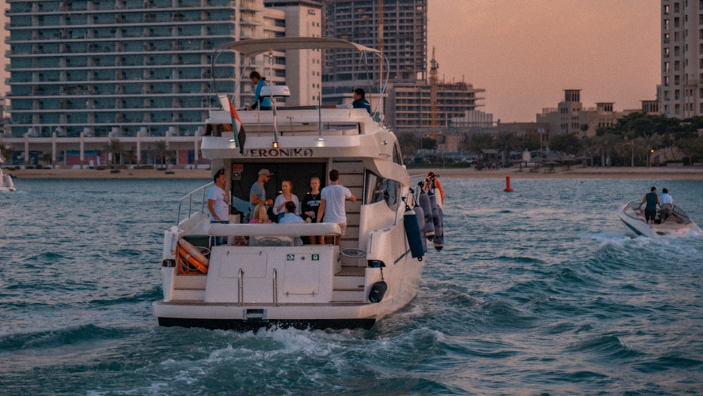 a group of people riding on the back of a boat