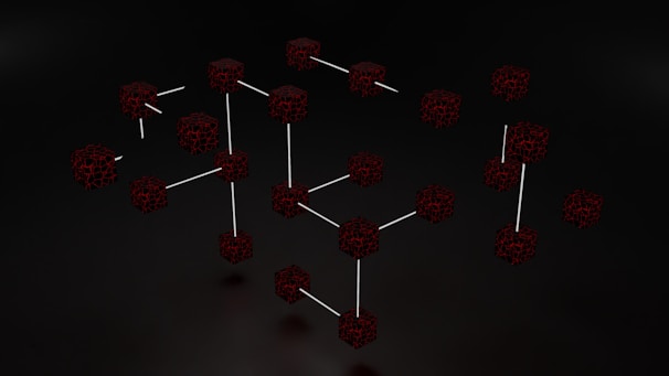 Clusters of interconnected cubes with a dark, web-like texture are set against a black background, with some cubes connected by thin white lines.