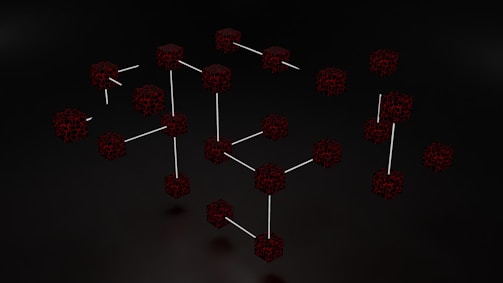 a group of red cubes with sticks sticking out of them
