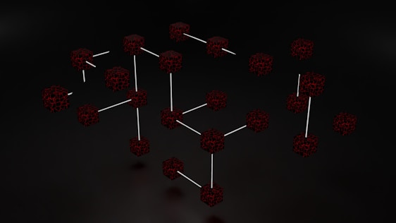 Clusters of interconnected cubes with a dark, web-like texture are set against a black background, with some cubes connected by thin white lines.