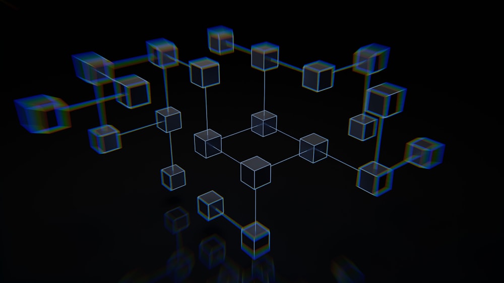 a group of cubes that are on a black surface