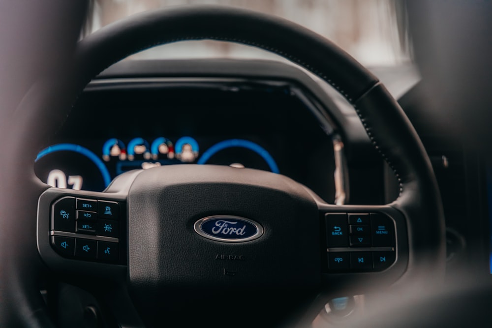 a close up of the steering wheel of a car