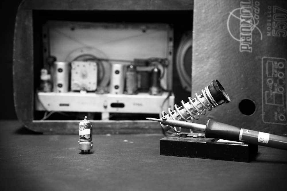 a black and white photo of a microphone and amp
