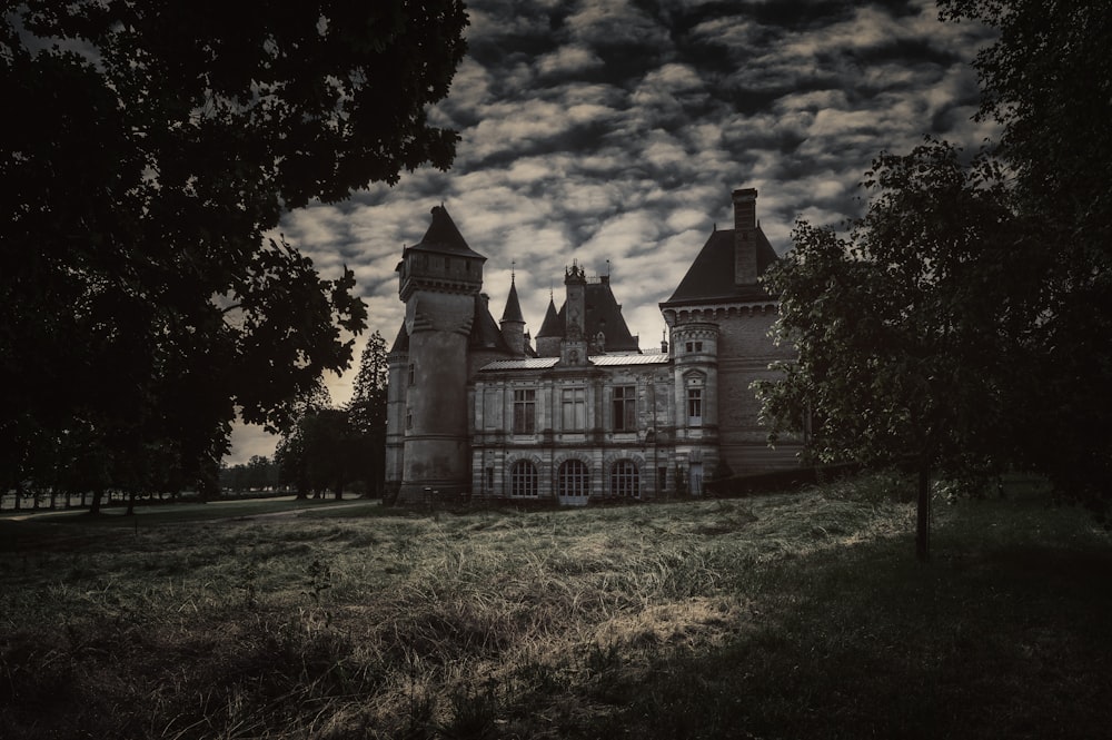 a large building sitting in the middle of a field