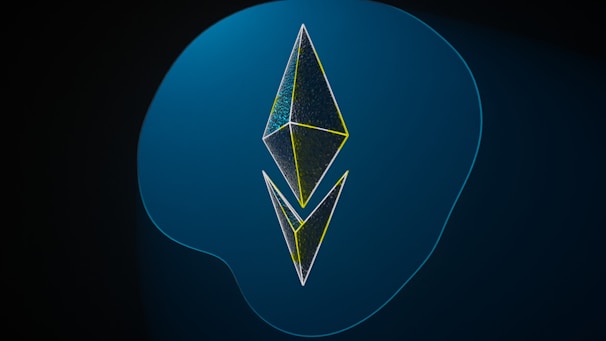 A geometric design consisting of two three-dimensional kite-shaped polygons stacked vertically against a gradient blue background. The shapes have thin outlines with a neon yellow tint, creating a modern and digital appearance.