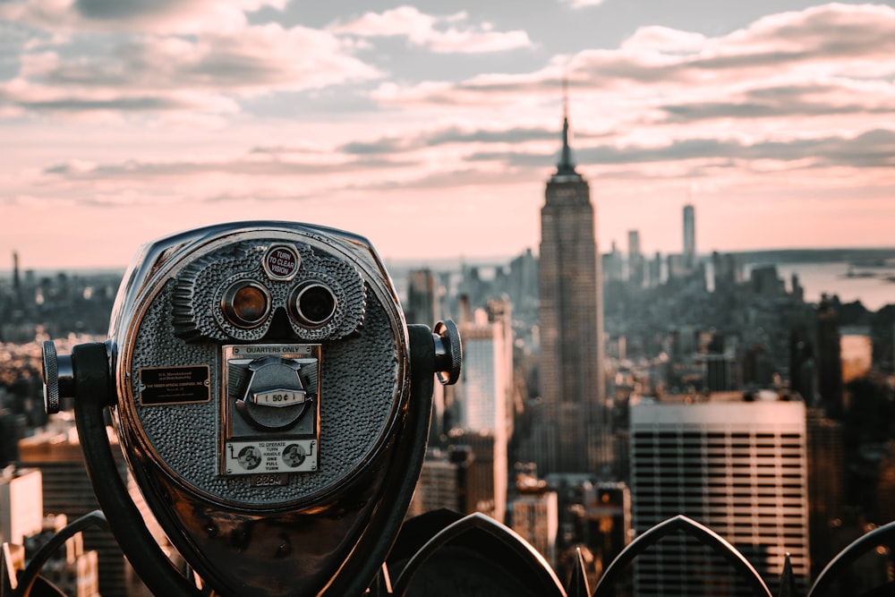 a pair of binoculars overlooking a city skyline