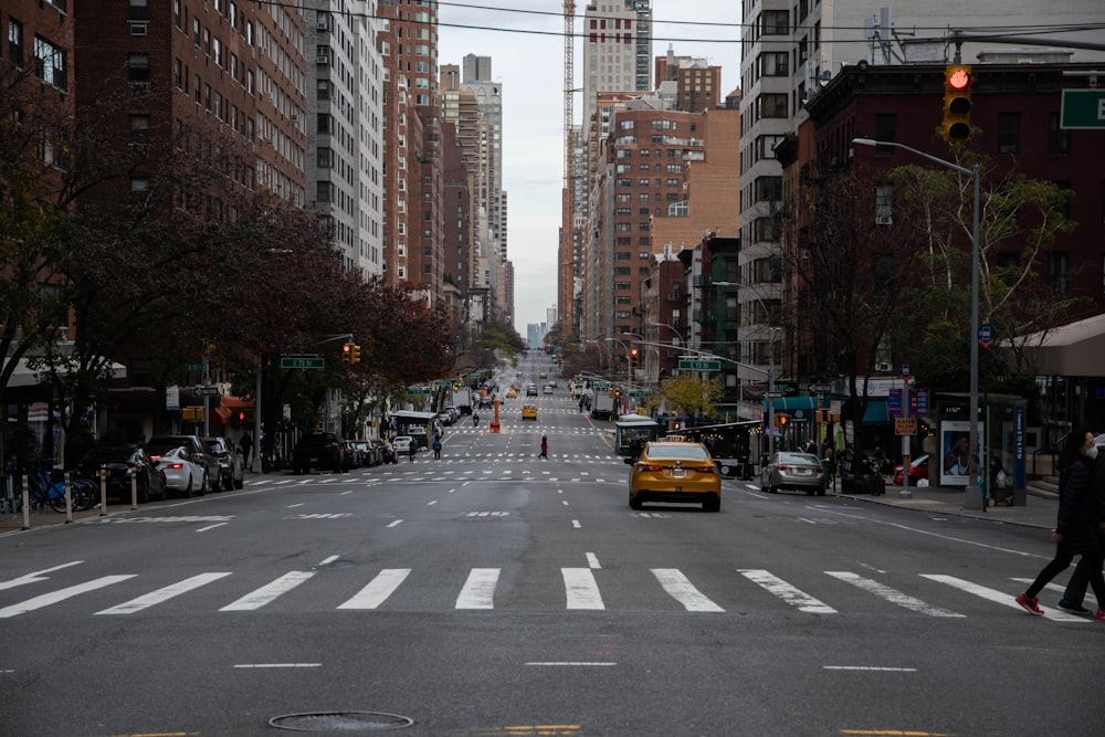 a city street filled with lots of tall buildings