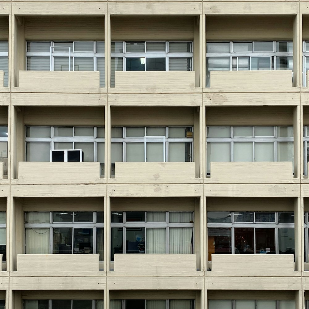 an apartment building with multiple balconies and windows