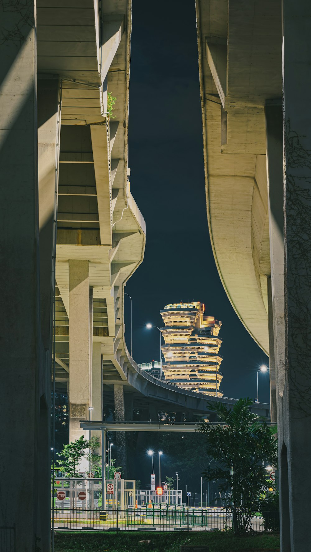 a view of a building from under a bridge