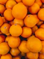 a pile of oranges sitting next to each other
