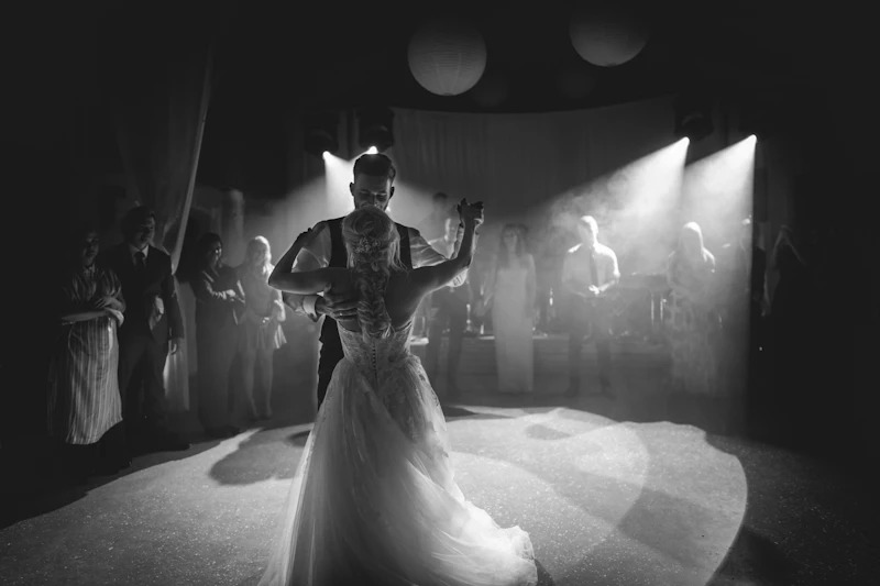 Couple dancing in front of a crowd at a sangeet