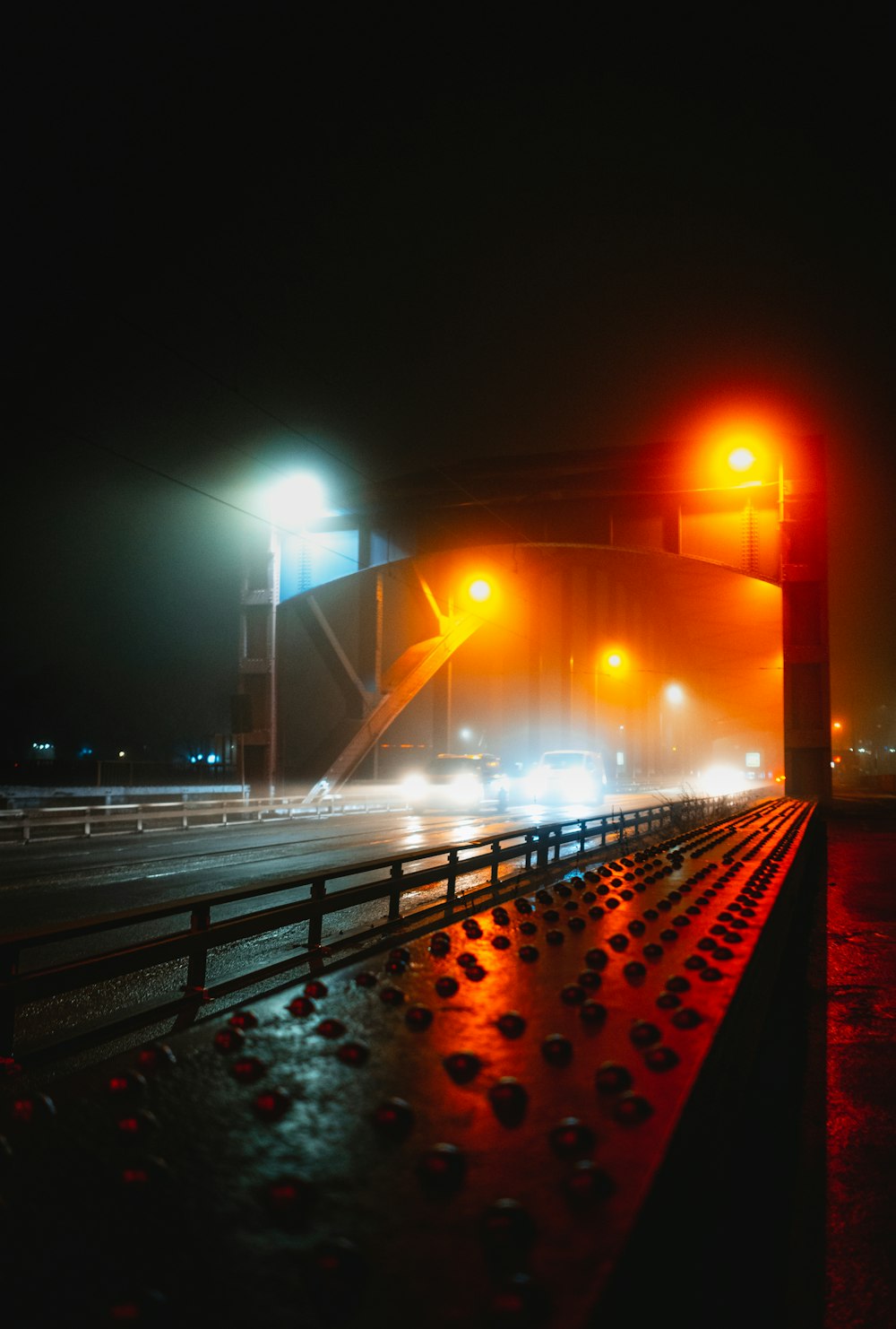 a train station at night with street lights