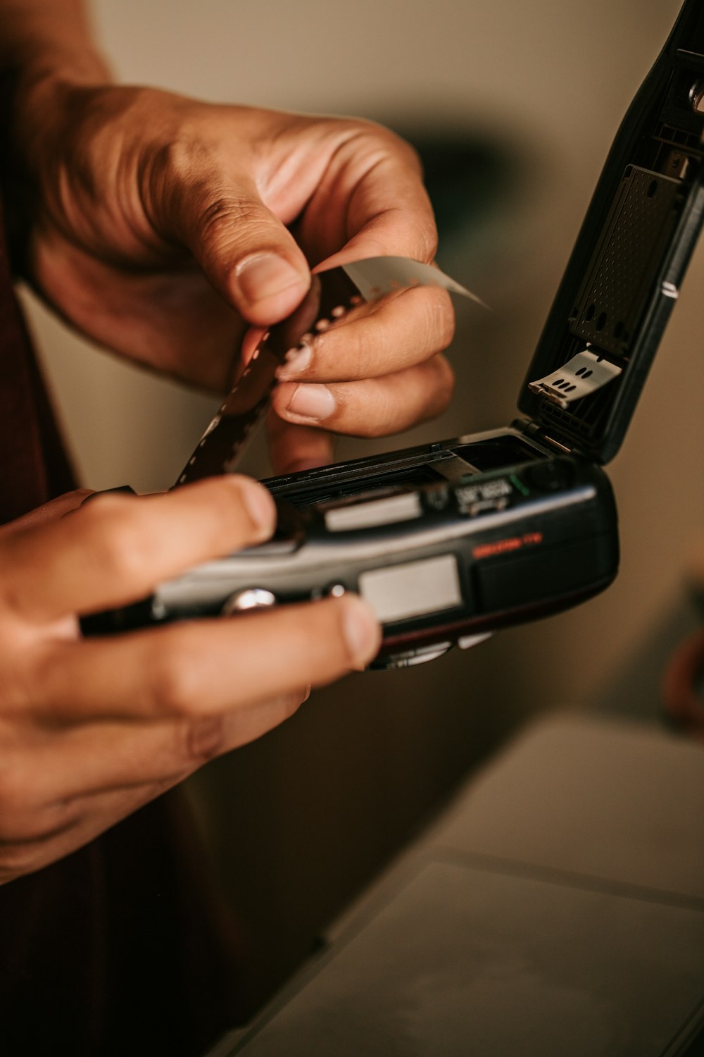 a person holding a cell phone in their hands