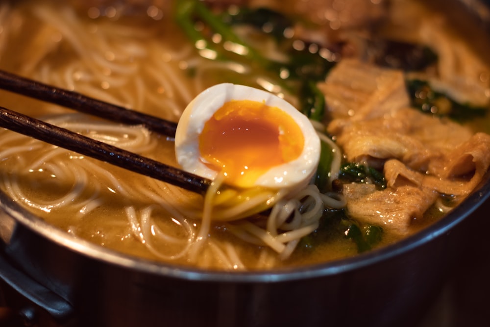 a bowl of ramen with an egg on top