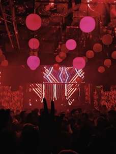 A panoramic view of a nightclub ceiling covered in vibrant LED screens displaying dynamic, colorful patterns.