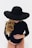 a woman wearing a black hat and a black bodysuit