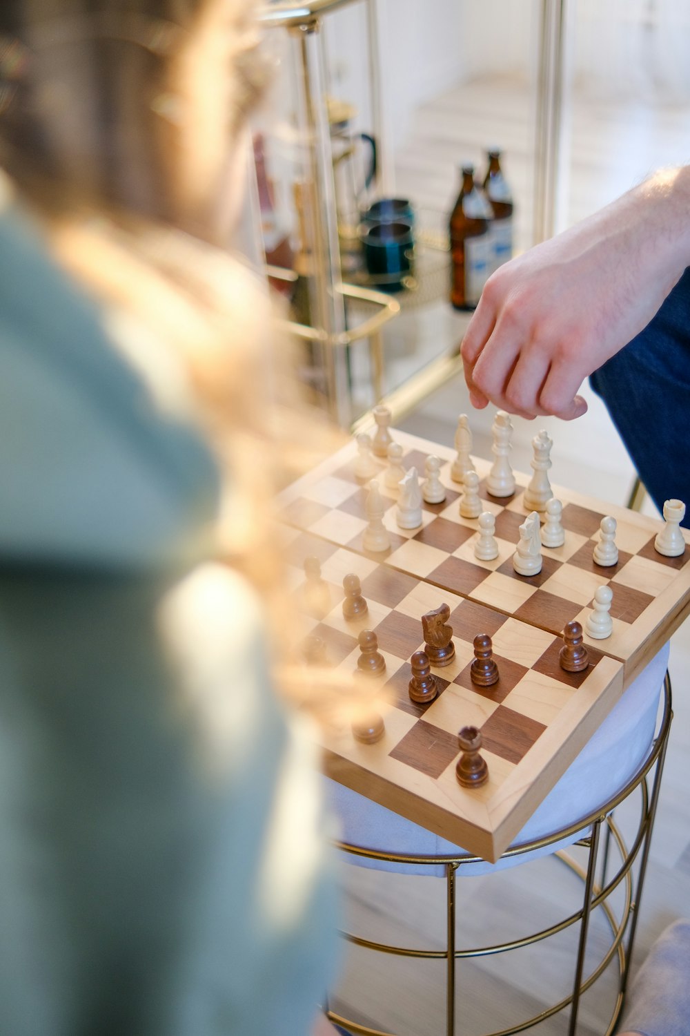 a person playing a game of chess on a table