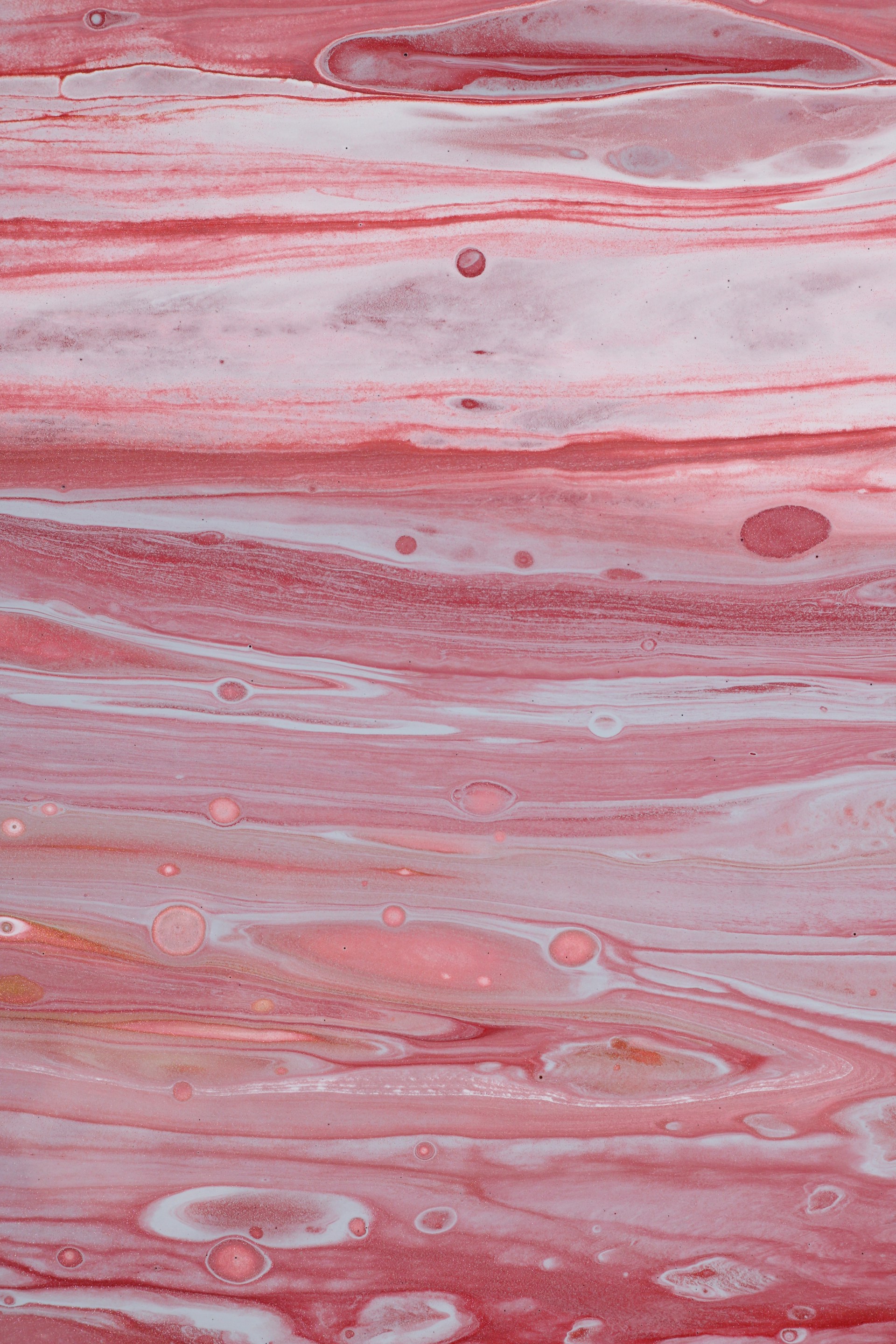 a close up of a red and white substance