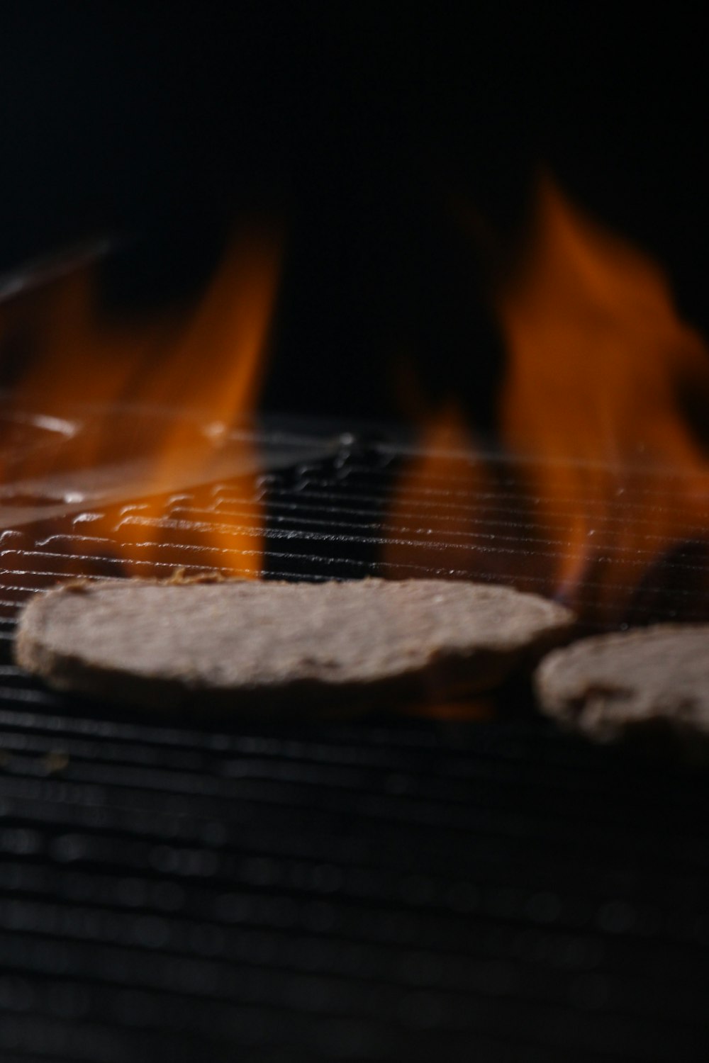 a close up of food cooking on a grill