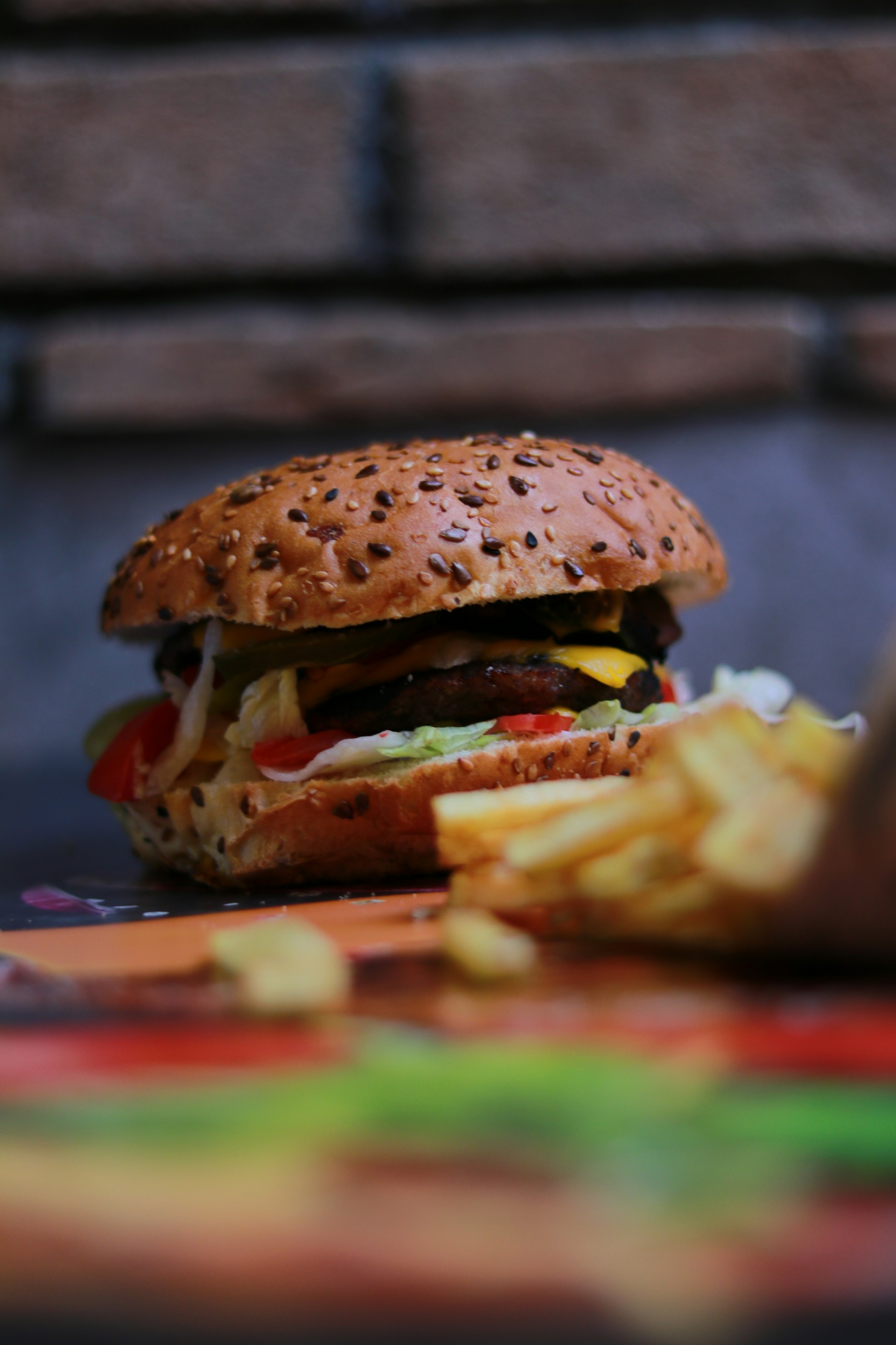 a hamburger and french fries on a table