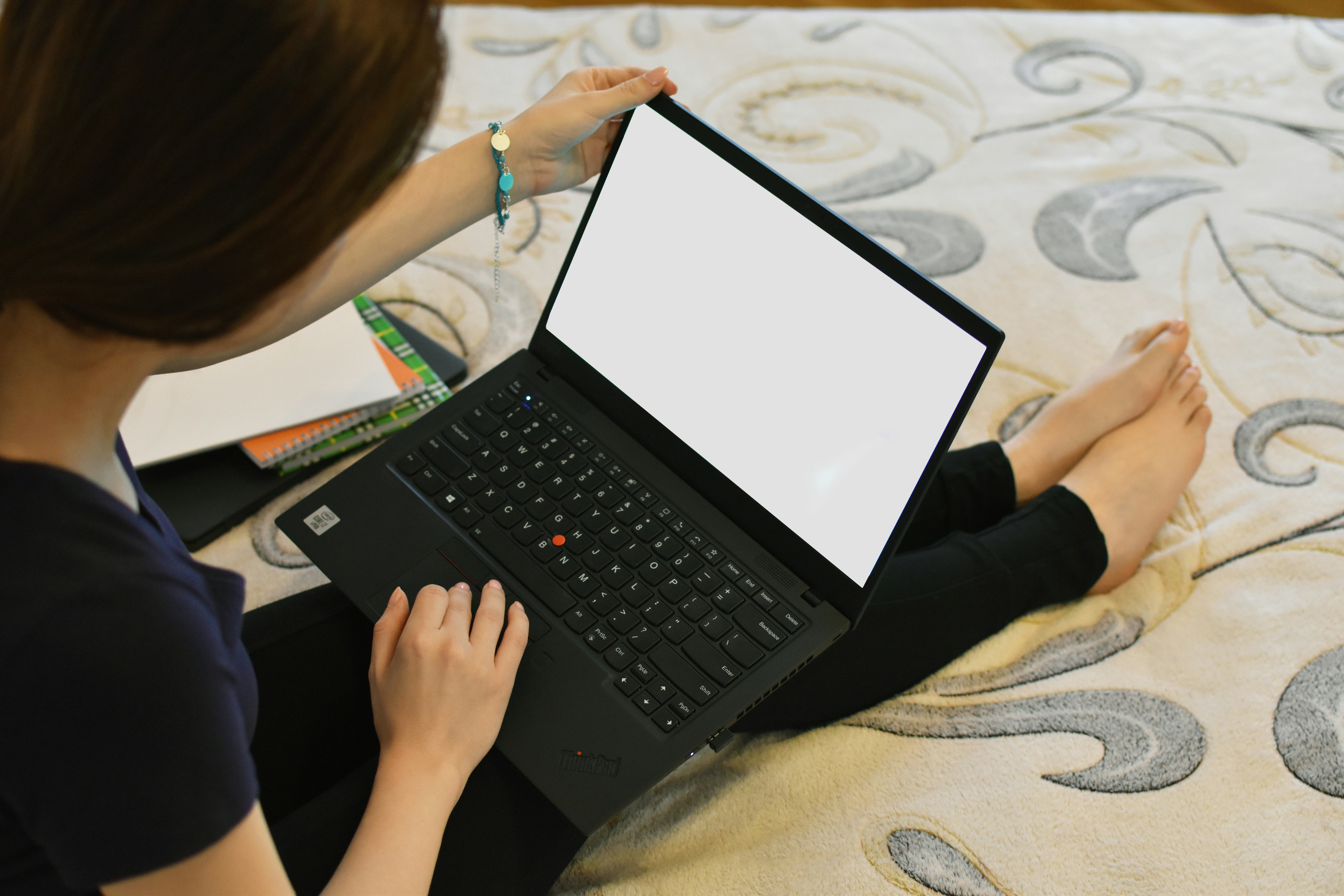 An image of a person writing alt text on a laptop
