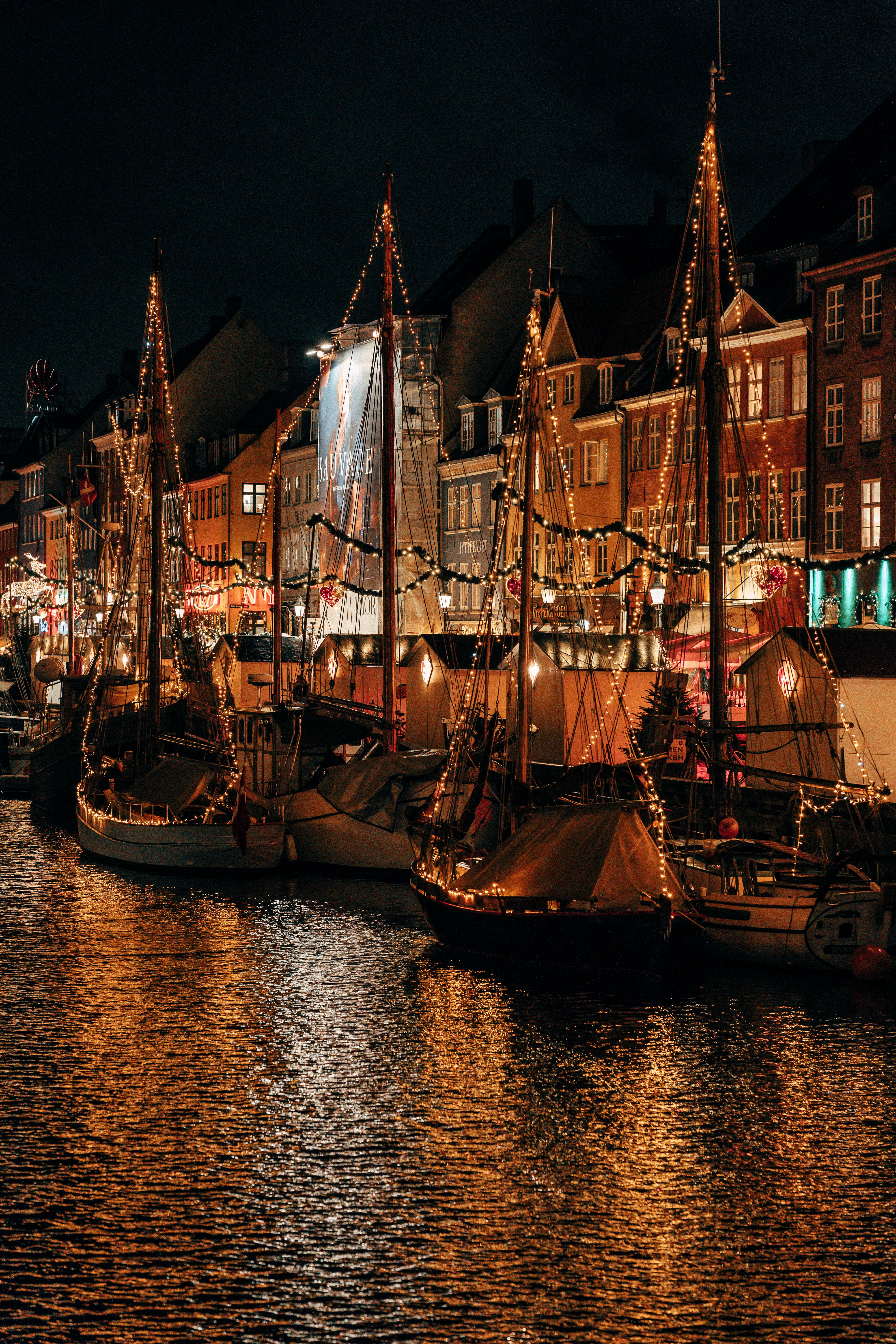 a group of boats that are sitting in the water