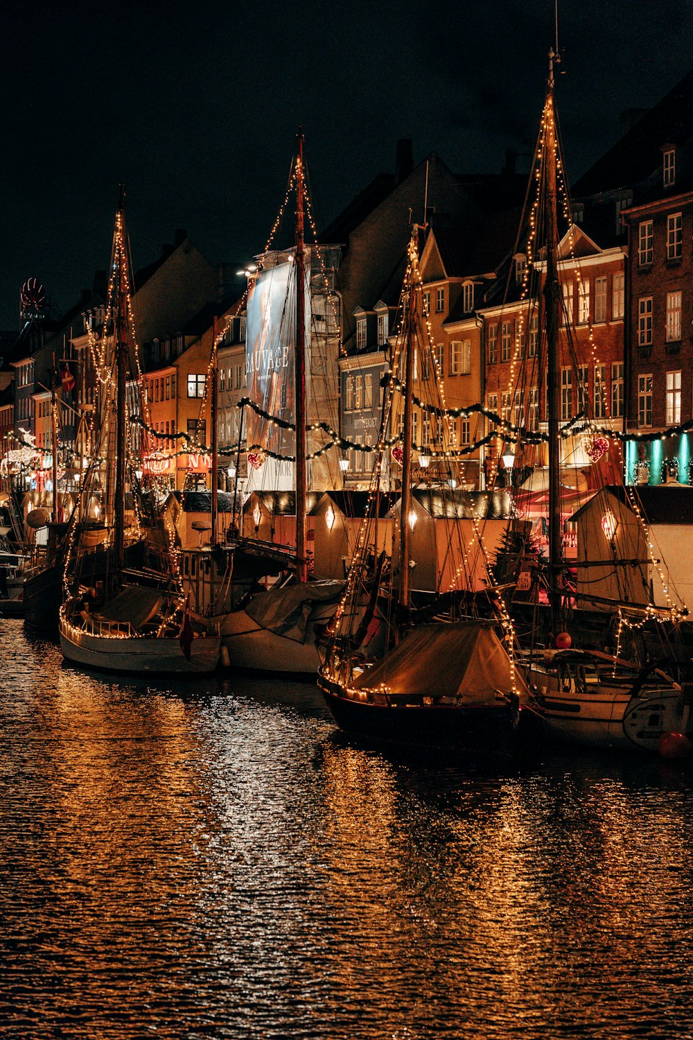 a group of boats that are sitting in the water