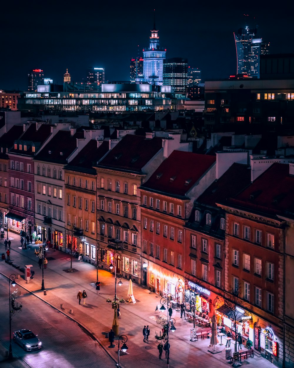 a city at night with a lot of tall buildings