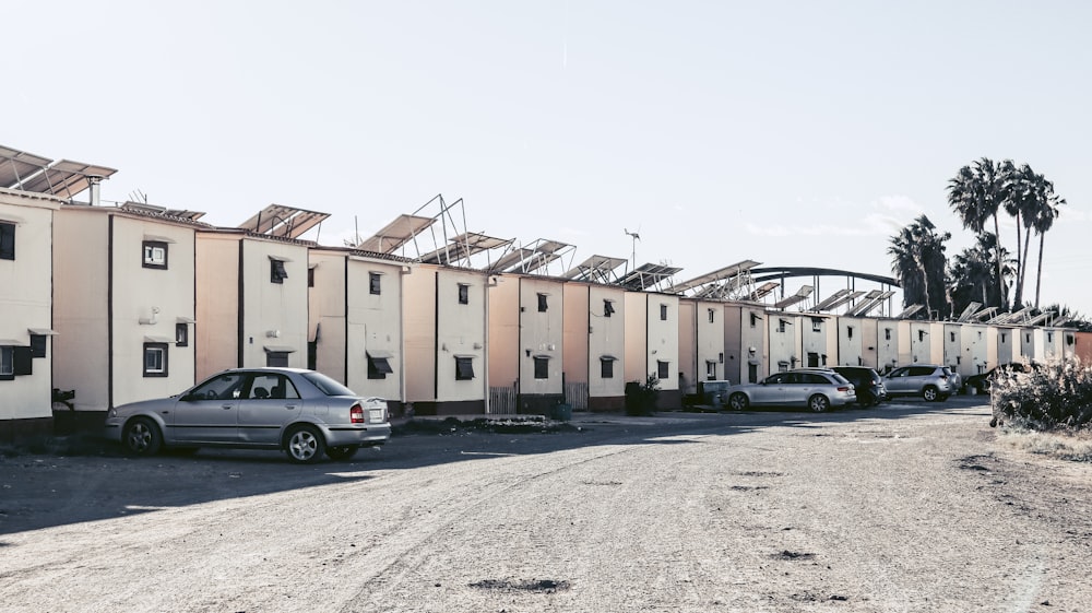 a car parked in front of a row of houses