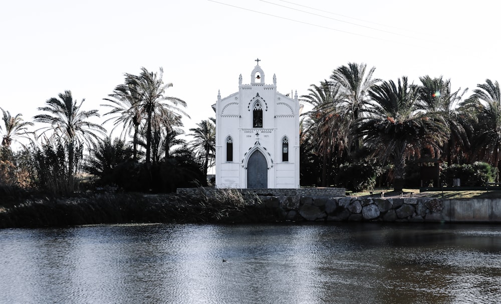 a church on the side of a body of water