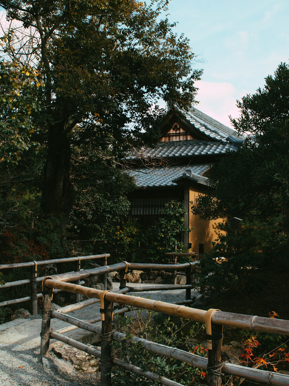 a wooden fence with a building in the background