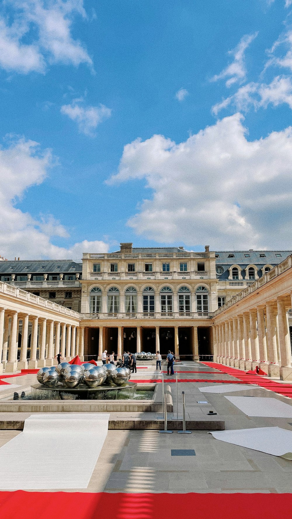 a large building with a red carpet on the ground