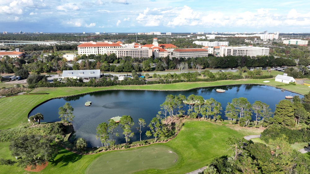 an aerial view of a golf course and a lake