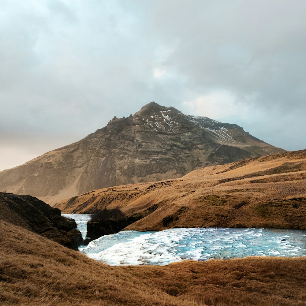 a mountain with a lake in the middle of it