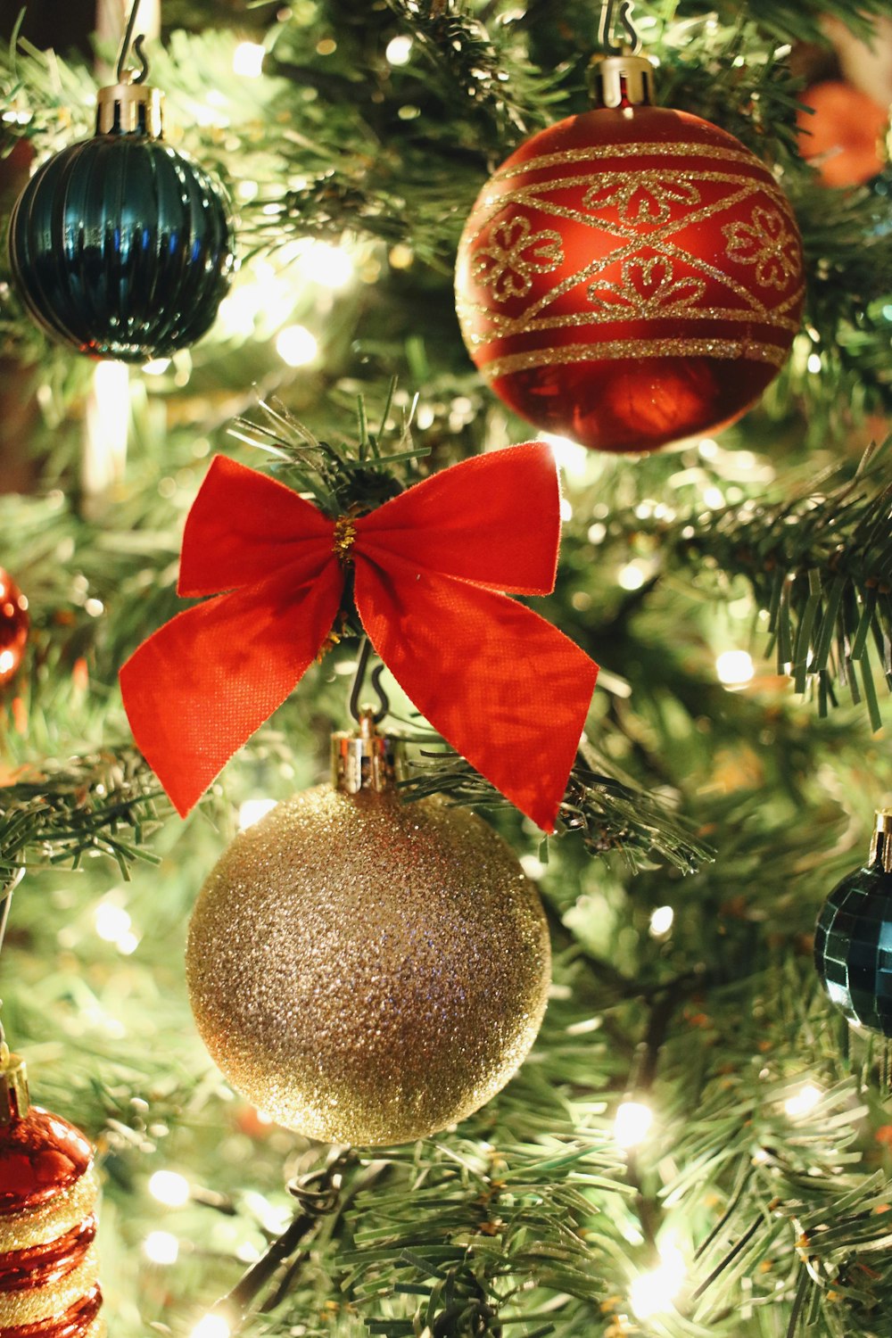 a close up of a christmas tree with ornaments