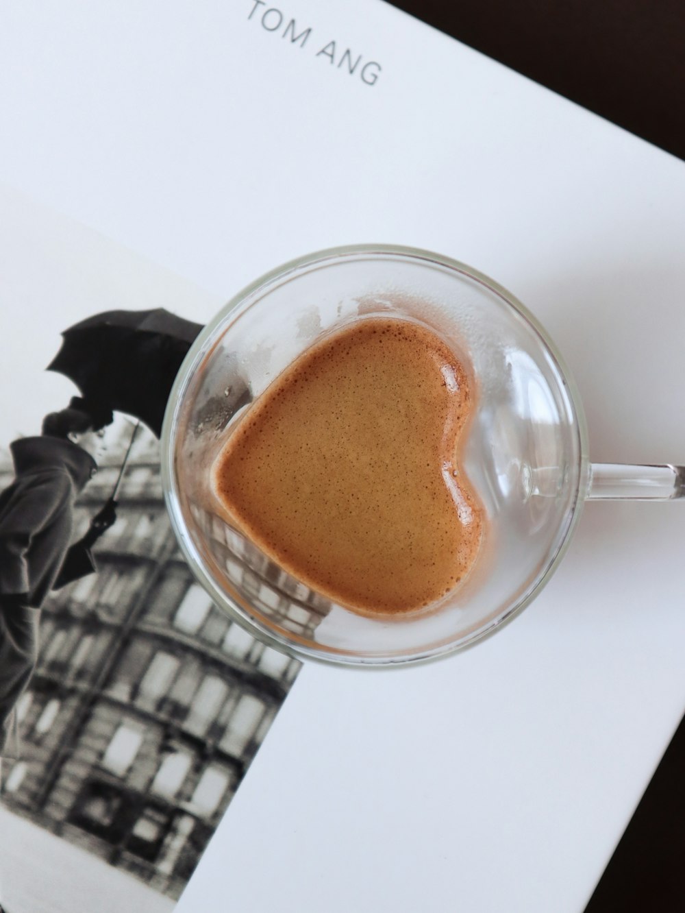 a cup of coffee sitting on top of a table