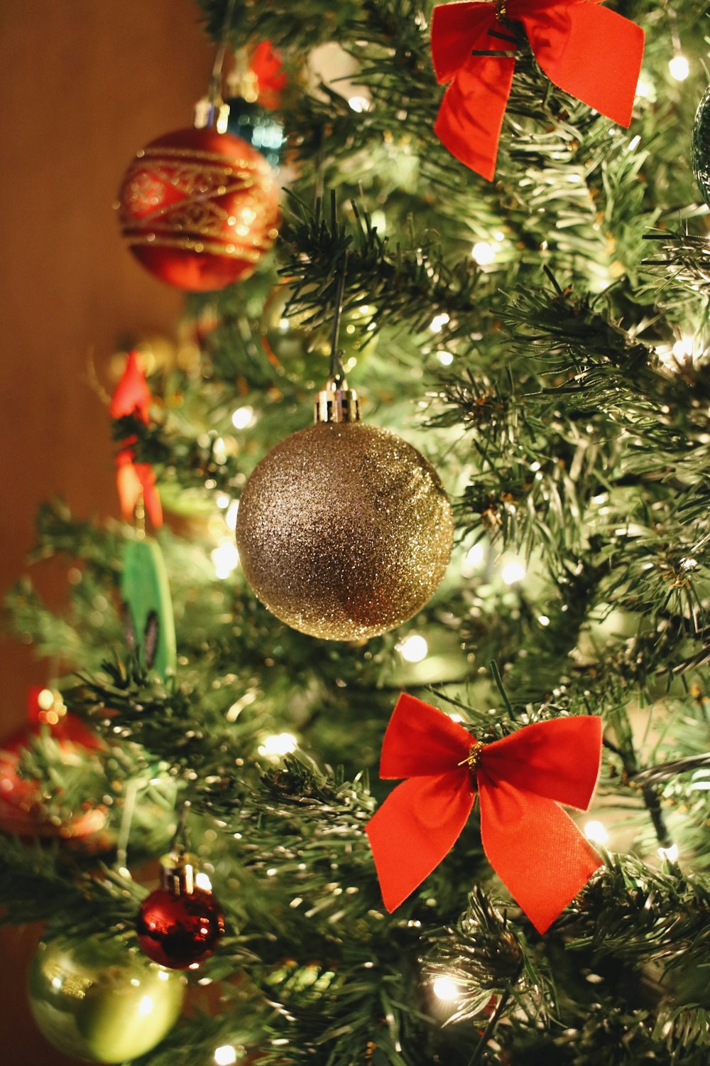 a close up of a christmas tree with ornaments