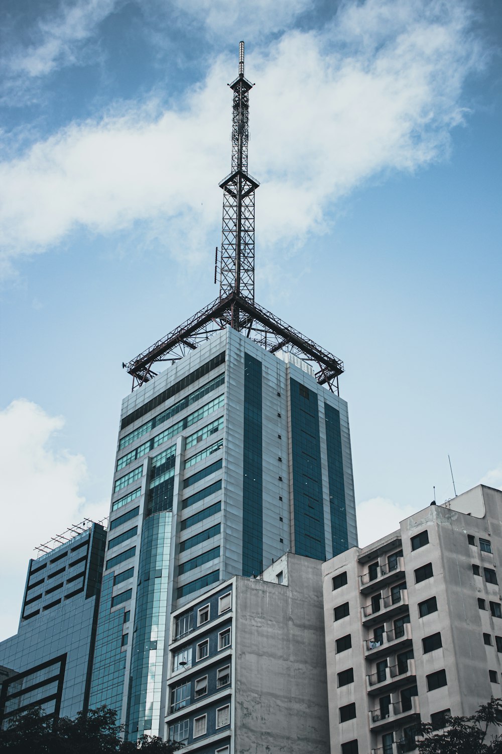 a tall building with a sky scraper on top of it