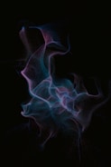 a black background with blue and pink smoke