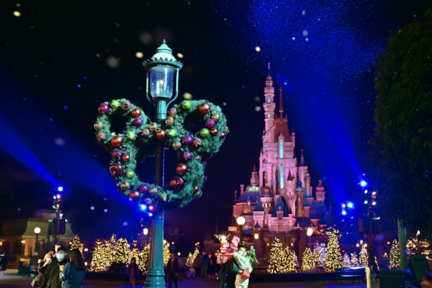 A pastel-hued fairy tale scene with delicate sparkles and subtle Mickey ear silhouettes glowing softly.