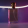 Close-up of a sleek car perfume bottle resting on a dashboard with soft natural light.