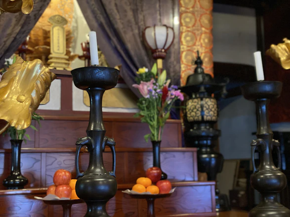 A serene altar with candles, crystals, and a softly glowing leopard figurine.