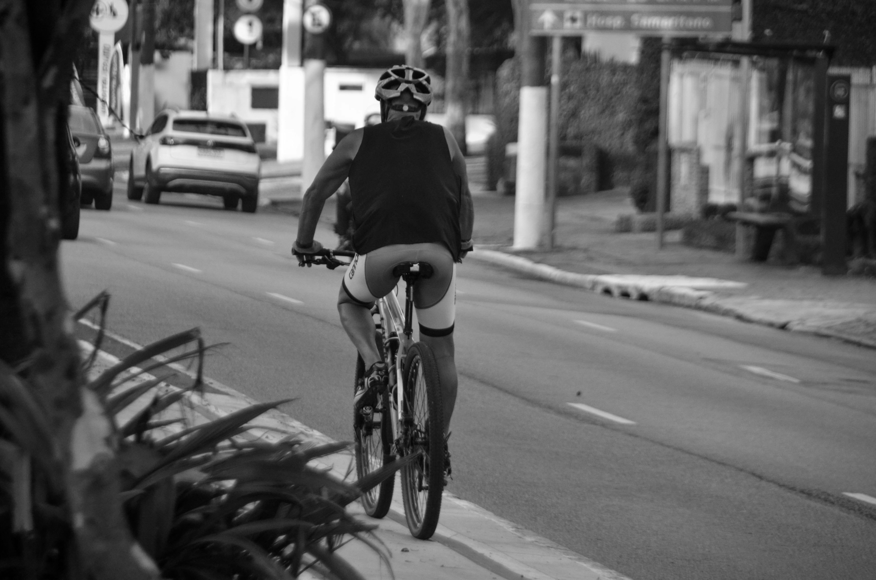 a man riding a bike down a street