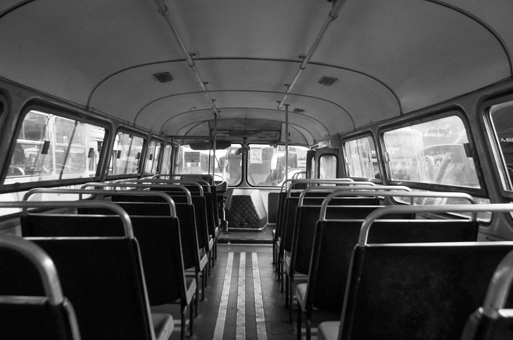 a black and white photo of the inside of a bus