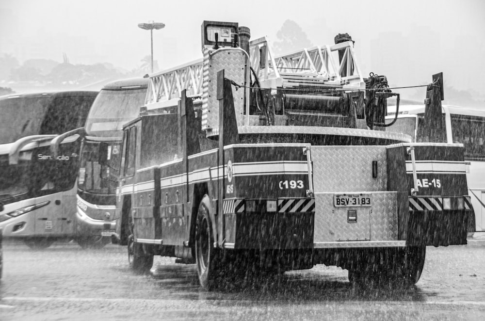 a couple of fire trucks parked in a parking lot