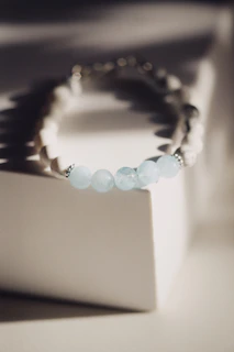a close up of a bracelet on a table