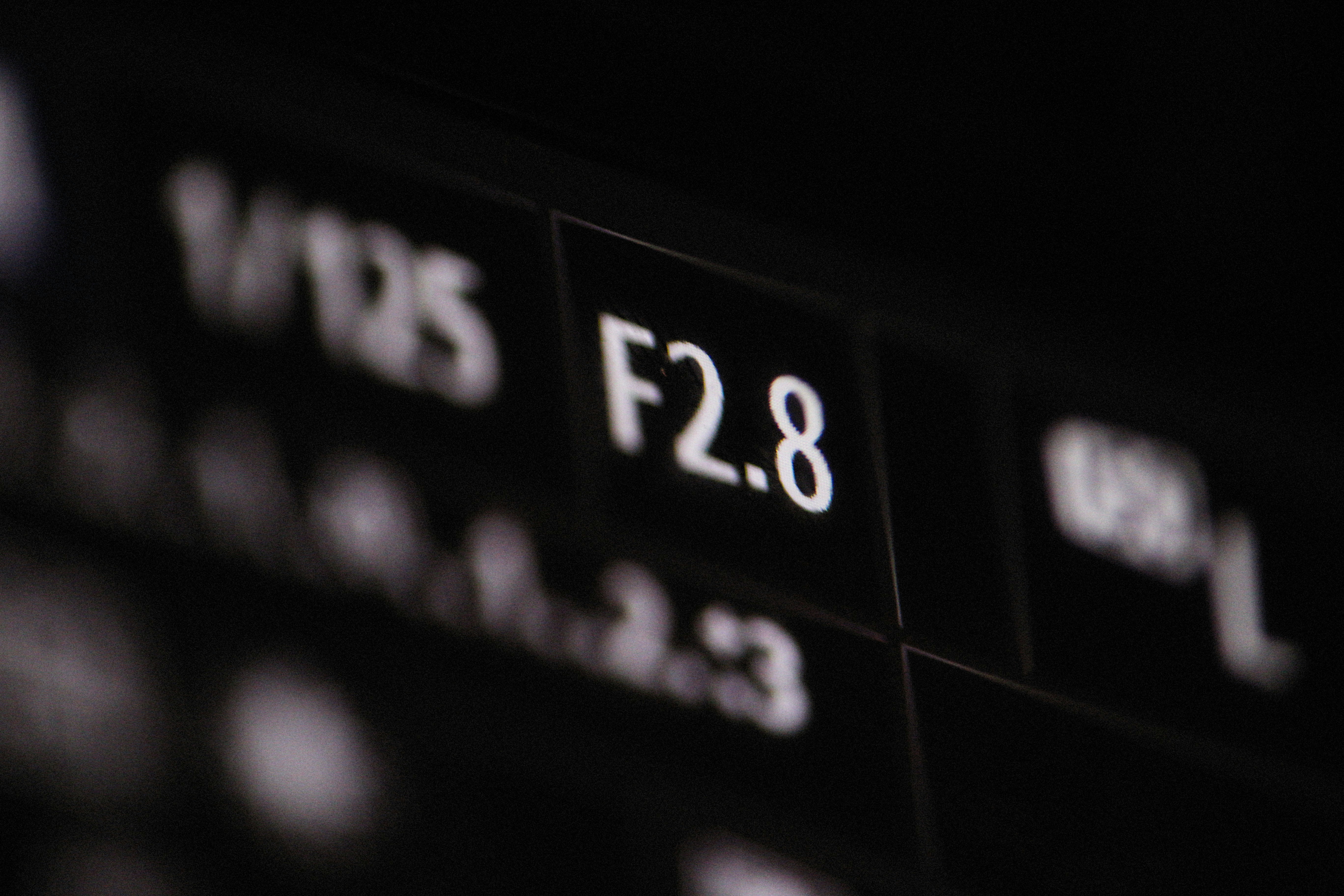 a close up of a black and white photo of a clock
