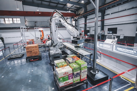 a machine is moving boxes in a factory
