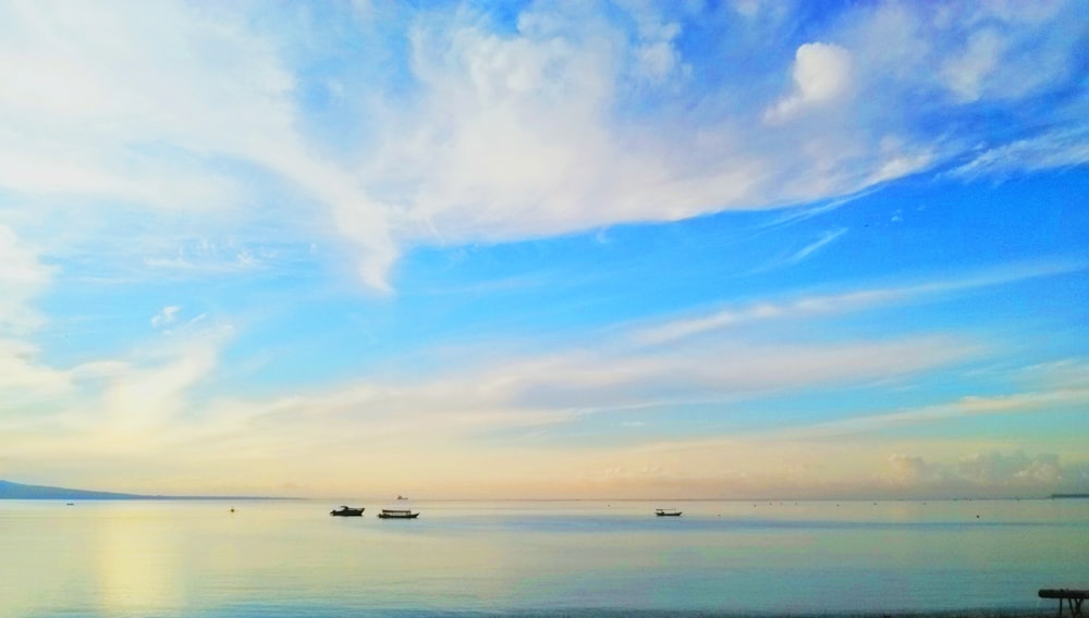 a beautiful view of a body of water with boats in the distance